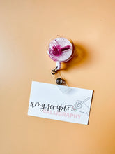 load image into gallery viewer, glitter pill badge reel, pink