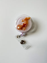 load image into gallery viewer, gold barbie shoe badge reel