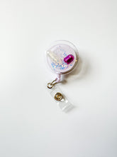 load image into gallery viewer, glitter pill badge reel, iridescent