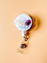 load image into gallery viewer, glitter pill badge reel, iridescent