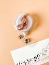 load image into gallery viewer, gold barbie shoe badge reel