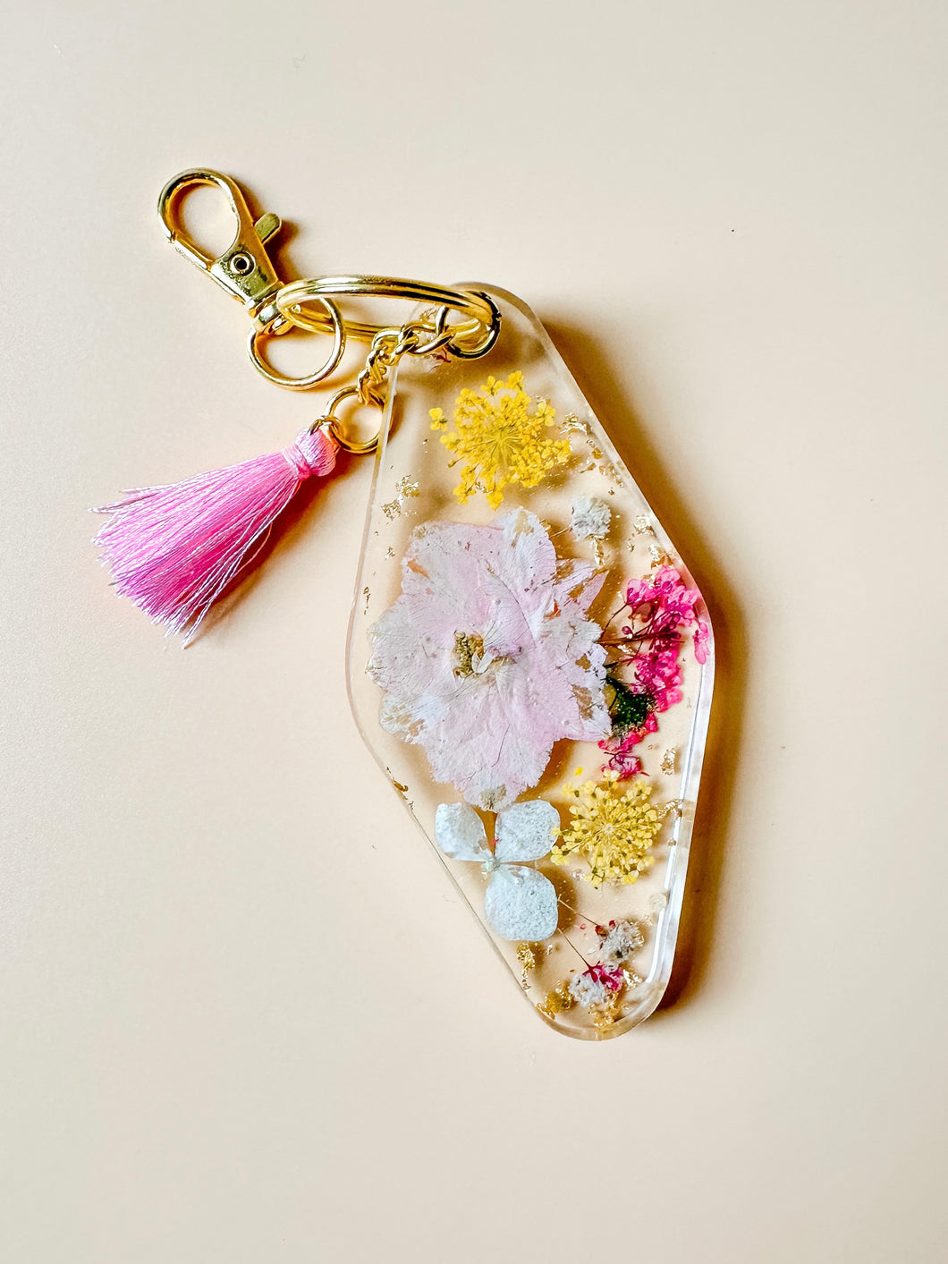 pink/yellow dried floral keychain with gold flakes