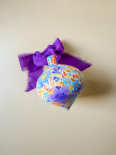 load image into gallery viewer, hand painted ceramic ornament, purple and orange with holo glitter
